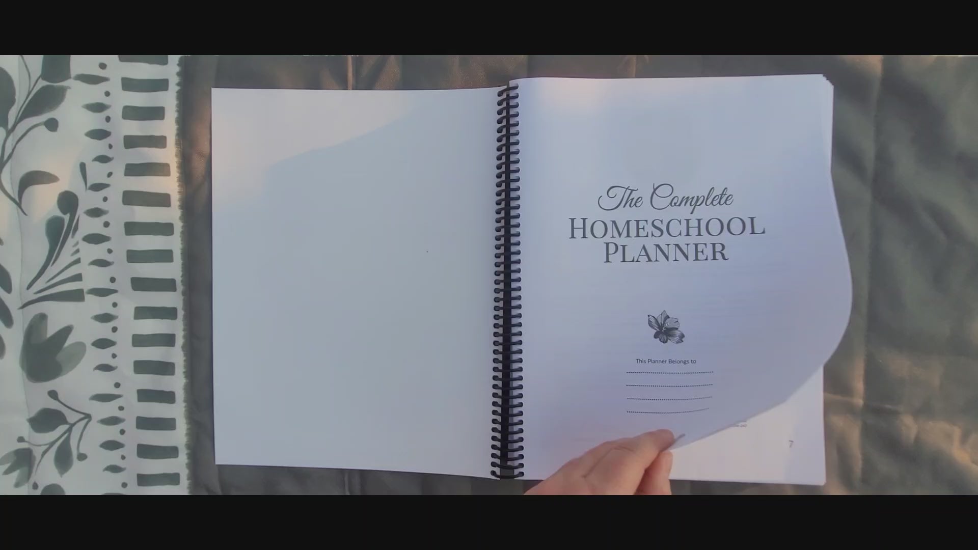 flipping through all the pages in the homeschool planner 